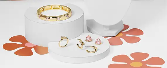 Bracelet and earrings layed out flat